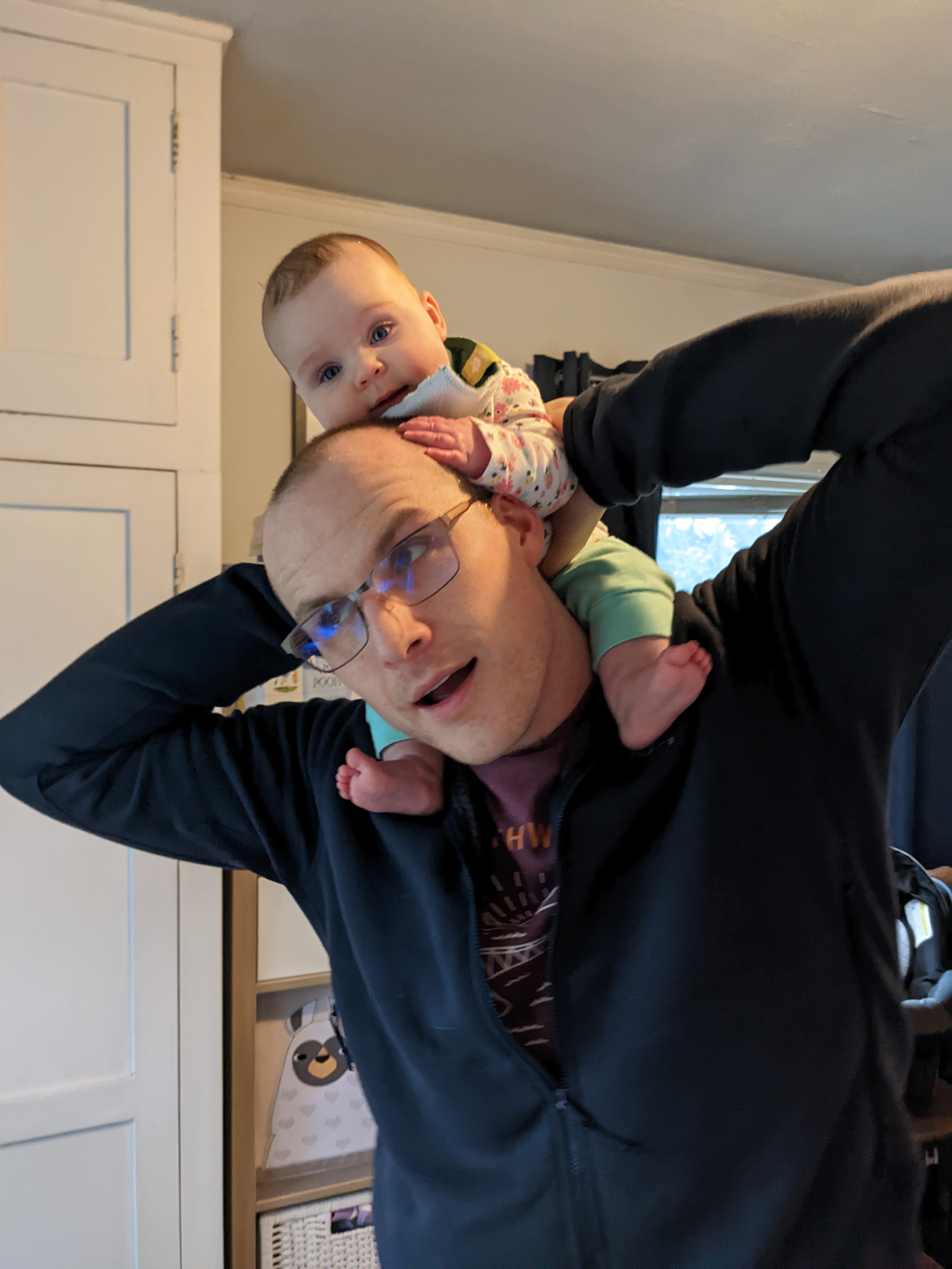 Daniel Revier with his daughter Ridley on his shoulders